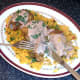 Enjoying turmeric baked chicken thighs and rice with spicy sauce