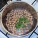 Coriander is added to drained chickpeas