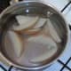 Potato wedges are steeped before being parboiled