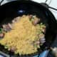 Cooled rice is added to wok