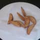 Twice fried wedges are drained for service