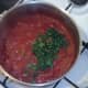 Chopped coriander is added to turkey curry