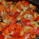Step six: Add chopped red capsicum. Continue stir-cooking for a while.
