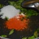 Step five: Add masala powders, hing powder, sugar, and salt to the pan.