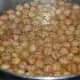 Observe, in the last stages of frying, chickpeas float on the surface