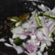 Step four: Throw in the chopped onions and slit green chilies. Saute on low fire for 2 minutes.