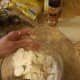 Step 5: Slowly cut butter into dry ingredients until it begins to crumble.