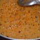 Step seven: Boil the jaggery syrup until you reach two-string consistency. Refer to the instructions to know how to get the right consistency.
