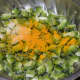 Apply the salt and turmeric and mix well. Keep aside for 20 minutes. Afterwards, squeeze out the water. Discard this bitter water and collect the dry bitter gourd pieces.