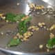Step one: Saute split chickpeas, mustard seeds, white lentils, curry leaves, and hing powder.