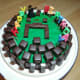 Then blocks of yummy chocolates were put on top, making a circle and, yes, just like building blocks of chocolates. A small warrior and a sword of &quot;Minecraft&quot; were added to the decorations. Then add birthday candles to the cake.