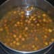 Step two: Boil the chickpeas, adding a little turmeric powder and salt.