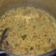 Mix well. Your spicy vegetable khichdi is ready!