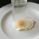 Drinking glass is used to cut circle from fried egg