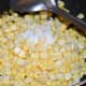 5. Add salt. Mix well. Stir-cook for 3-4 minutes. Now the sweet corn changes into a darker shade. Turn off the stove.