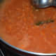 Step six: Add tomato puree. Mix well. Add a cup of water and some salt. Let the mix boil for 4-5 minutes.