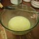 Mix the sugar, butter, and water in the large bowl. Then stir in the eggs and vanilla. 