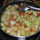 Add 1 cup of water. Boil the mixture and cover the pan. Keep the heat low. Cook for 6-7 minutes or until bottle gourd becomes soft.