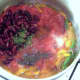 Tomatoes and beans join softened vegetables in the saucepan