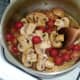 Tomato and mushroom sauce is brought to a simmer