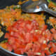 Step 5: Add chopped tomatoes.