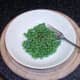 Peas are added to a small bowl and seasoned