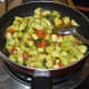 Stir-cooking the mixture.