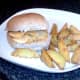 Double cheese and onion crisps sandwich and spicy wedges ready for service