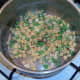 Drained peas are seasoned