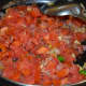 Step seven: Throw in chopped tomatoes. Cook on high heat till they become shape less. Turn off the stove.