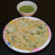 Place two urad dal pancakes on a serving plate. Serve them with a spicy coconut chutney or green chutney on the side. Enjoy!