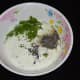 Step two: Put sour cream or yogurt, chopped dill leaves, roasted mustard seeds, vinegar, milk, salt, and pepper powder in a mixing bowl. Whisk them nicely.