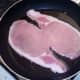 Back bacon is put on to fry