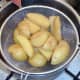 Parboiled chips are drained