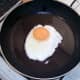Egg is added to frying pan