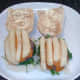 Chips are arranged on top of cheeseburgers