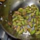 Step one: Heat oil in a deep-bottomed pan. Add mustard seeds. Let them pop up. Throw in eggplant cubes and curry leaves. Add some salt. Stir-cook them as per instructions.