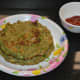 Serve two hot pancakes on a plate with a pickle, tomato sauce, or chutney. Enjoy!