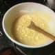 Add in the remaining 1/2 cup lukewarm water, 1/4 cup sugar, and the eggs, and beat until smooth with an electric mixer at medium speed, about 3 to 4 minutes. 