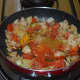 Add turmeric powder, subzi masala/garam masala powder, red chili powder, and coriander powder.