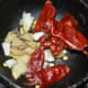 Step four: Saute ginger, cumin seeds, red chilies, and garlic for a minute in olive oil or butter.