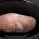 Place thawed turkey roast in crock pot.