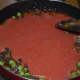Step five: Add tomato puree into the pan. Stir-cook until the mix becomes thick and oil appears on the edges.