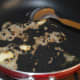 Step 2: Heat oil or butter in a deep-bottomed pan. Throw in cumin seeds, garlic, and peppercorns. Saute till cumin sizzles.