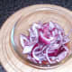 Sliced onion is added to the sauce