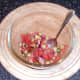 Salsa ingredients are carefully stirred together
