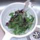 Washing mixed leaf salad