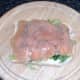 Smoked salmon is seasoned with black pepper