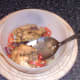 Turning chicken thighs in juices
