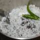 Step three: Put grated coconut, mustard seeds, salt, and green chilies in a mixer or blender.